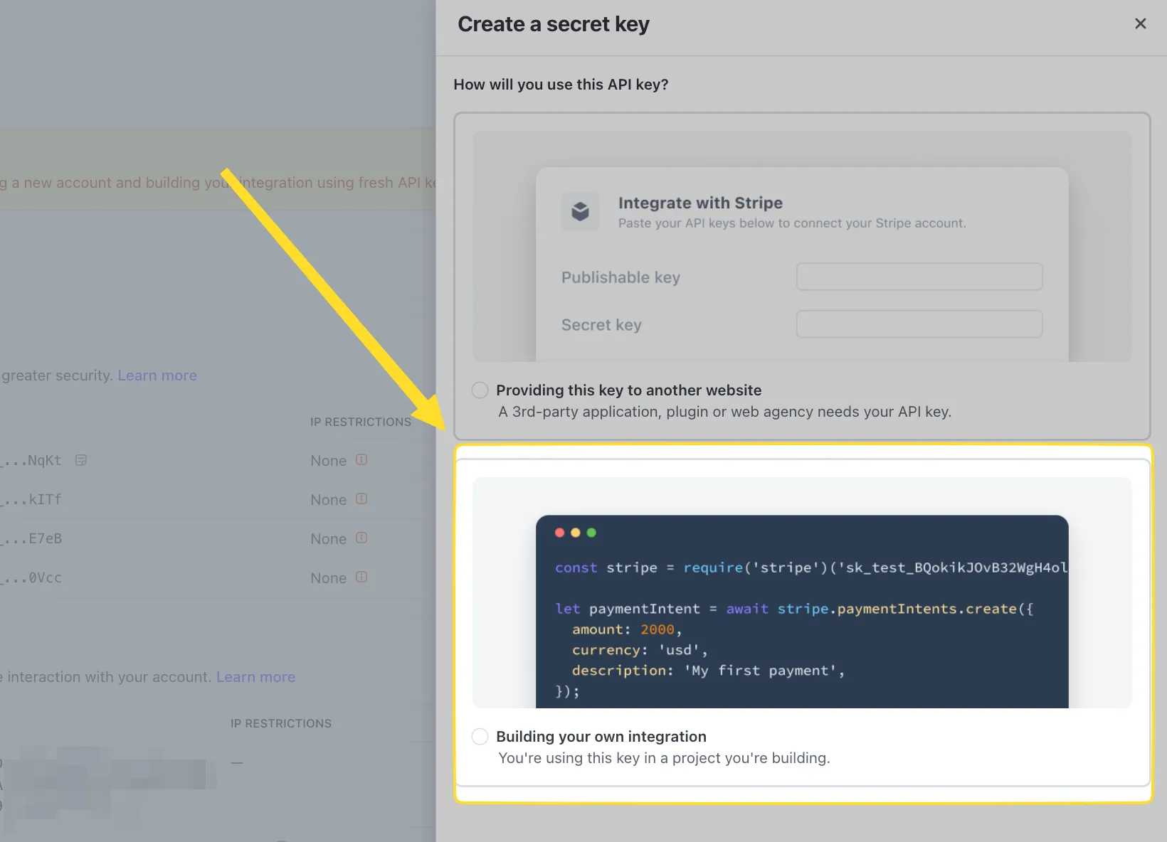 Stripe Create a secret key modal showing the Building your own integration option selected with a code example for creating a payment intent